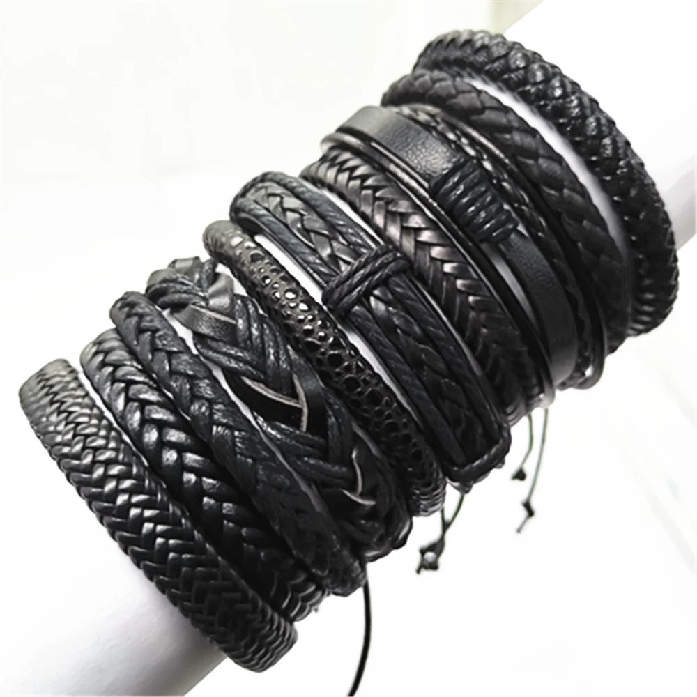 Stacked black leather bracelets on stand – The Crew
