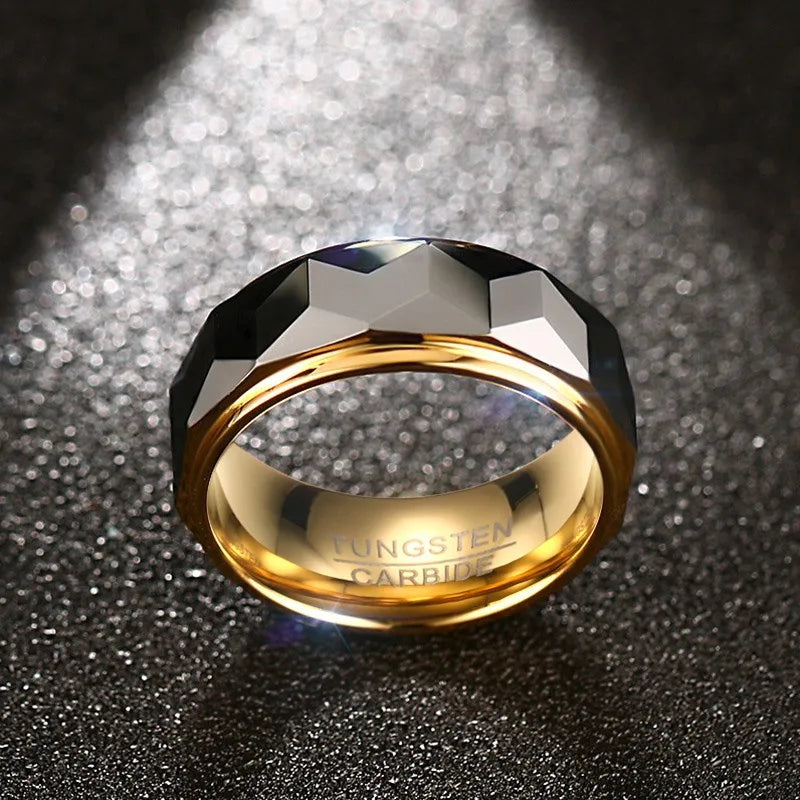 A Meaeguet multi-faceted silver tungsten ring displayed under a dramatic spotlight, showcasing its polished gold interior plating