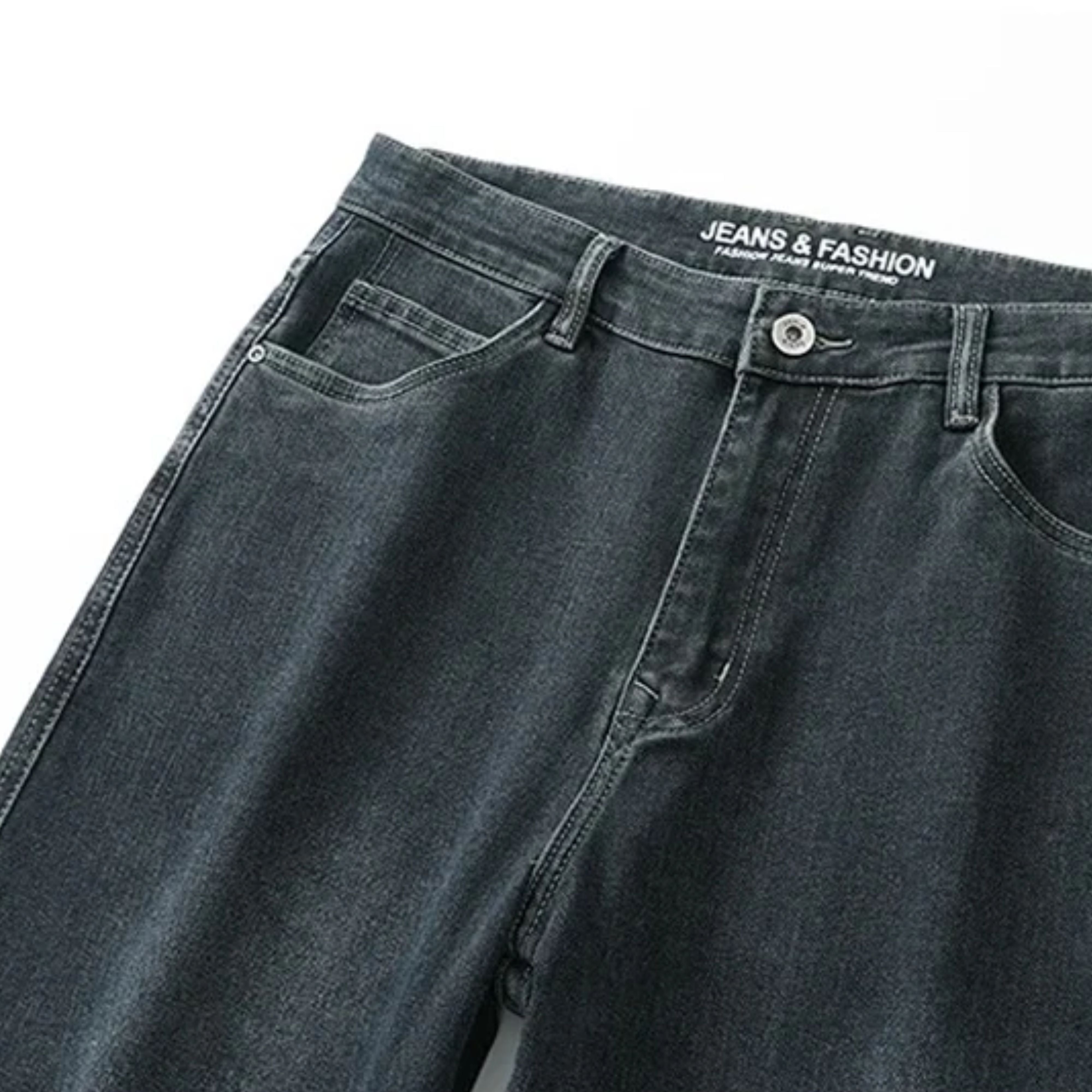 Close-up shot of the front waist section, demonstrating the reinforced metallic top button closure and clean flat-front stitch lines