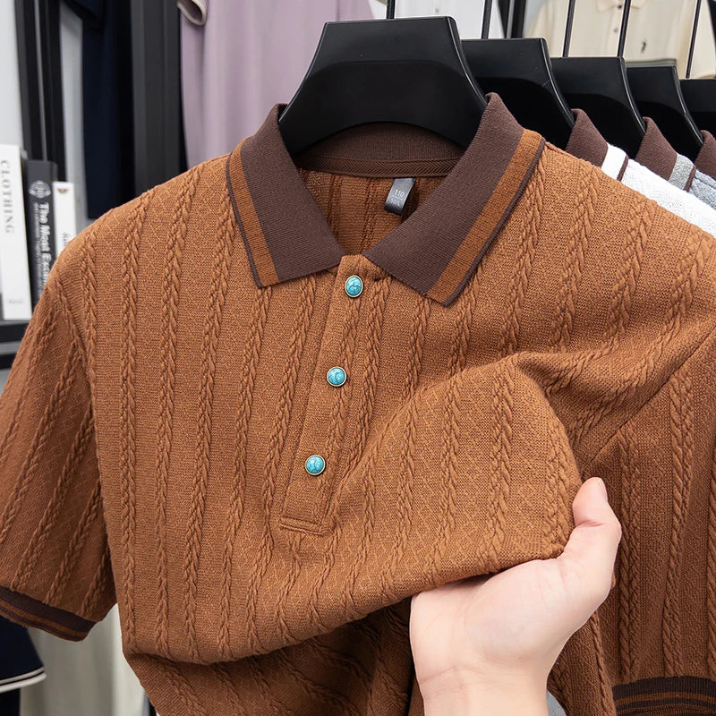Showroom rack view of the premium grey jacquard knit polo shirt showcasing the short-sleeve ribbed trim construction