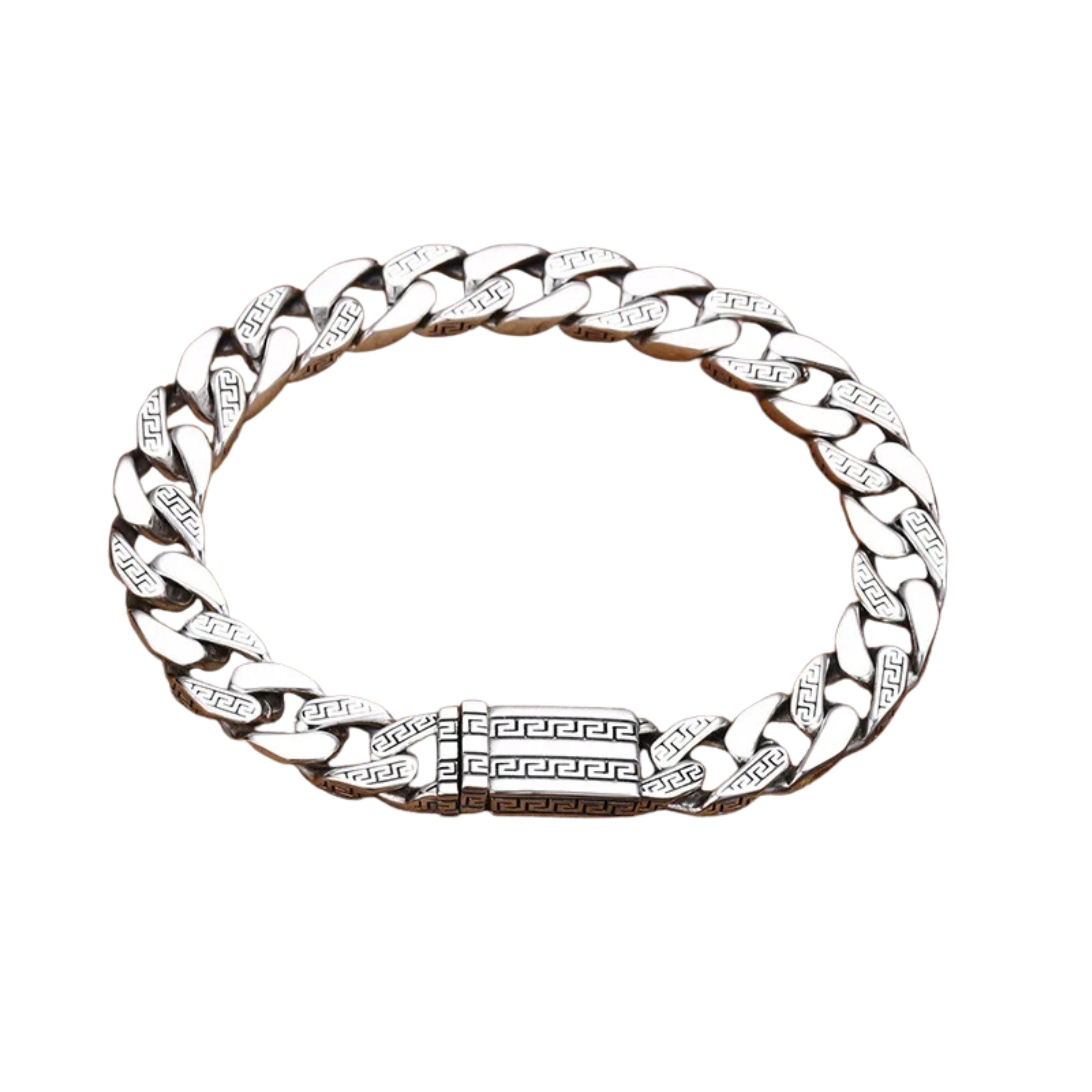 Men's silver Cuban link bracelet featuring a detailed Greek key engraved box clasp on a white background.