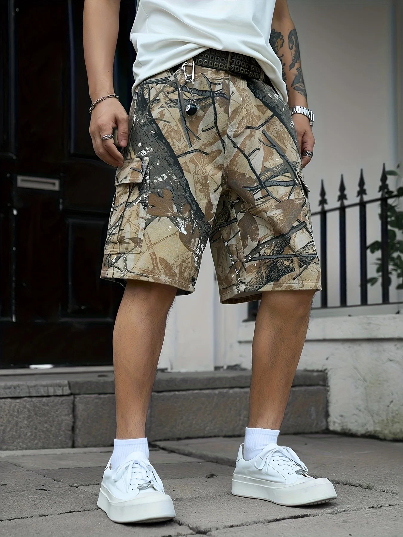 Three-quarter shot of a man wearing rugged non-stretch camouflage denim cargo shorts for summer