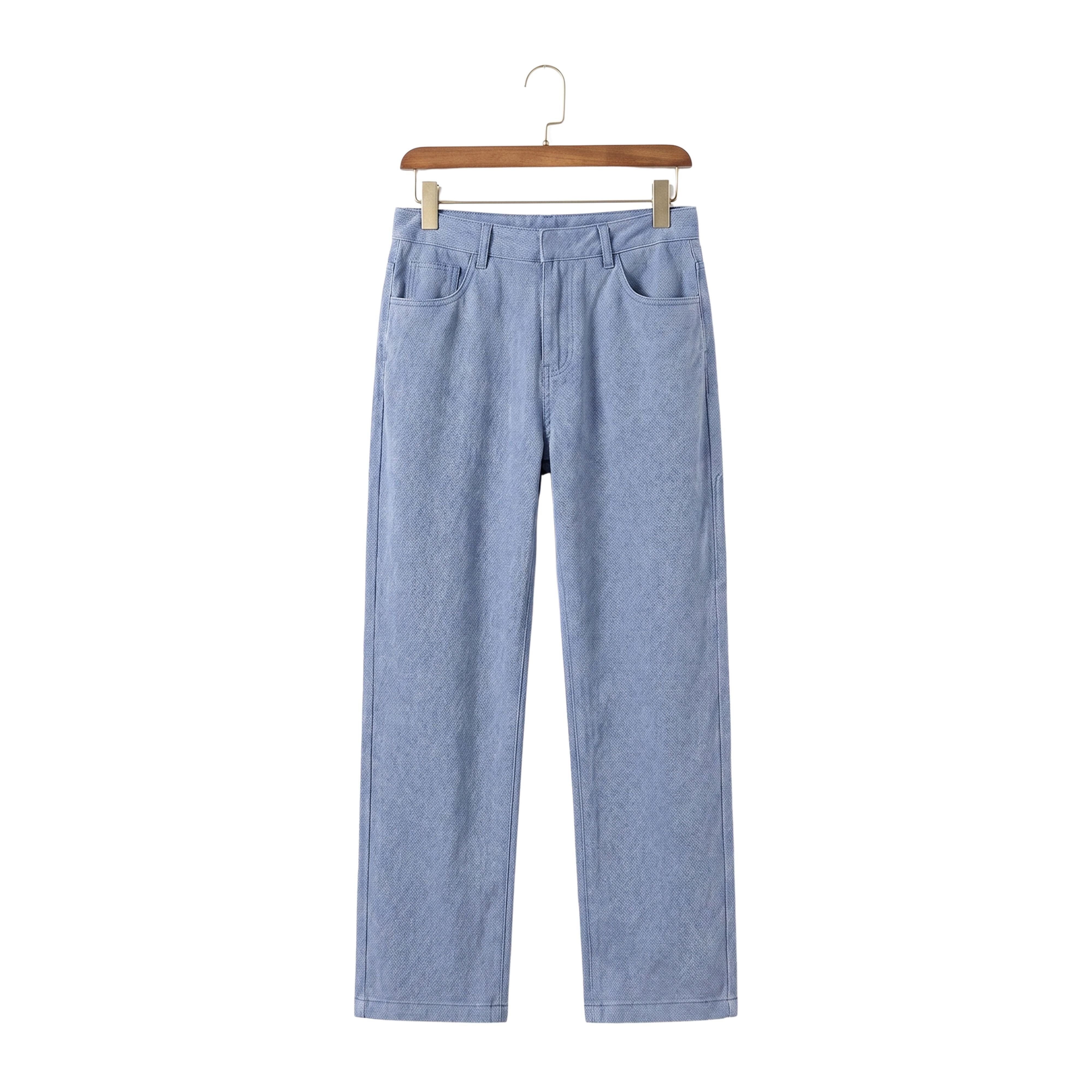 Premium soft Lyocell straight denim-look pants in a breezy summer light blue tone hanging on a wooden hanger