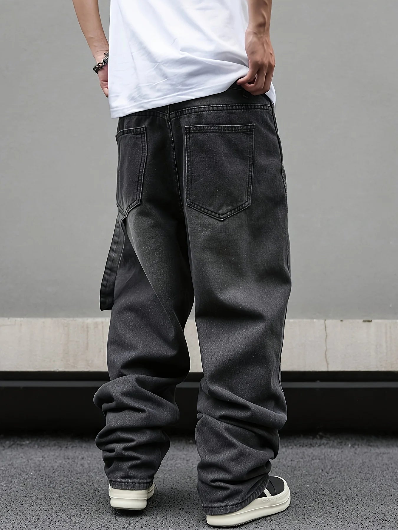 Three-quarter view of a man styling khaki micro flared hanging wide-leg pants with a short sleeve shirt