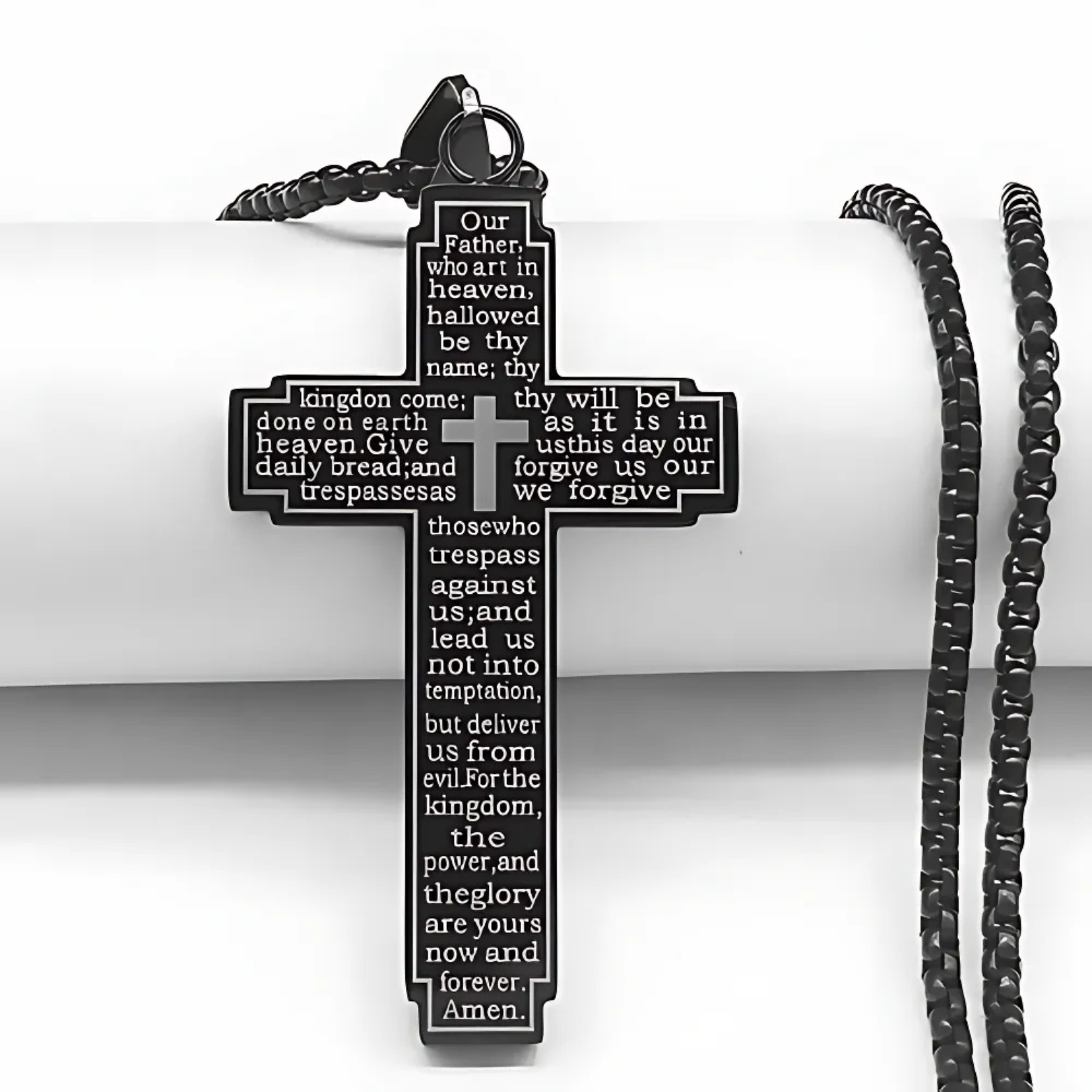 Black engraved cross necklace close-up – The Crew