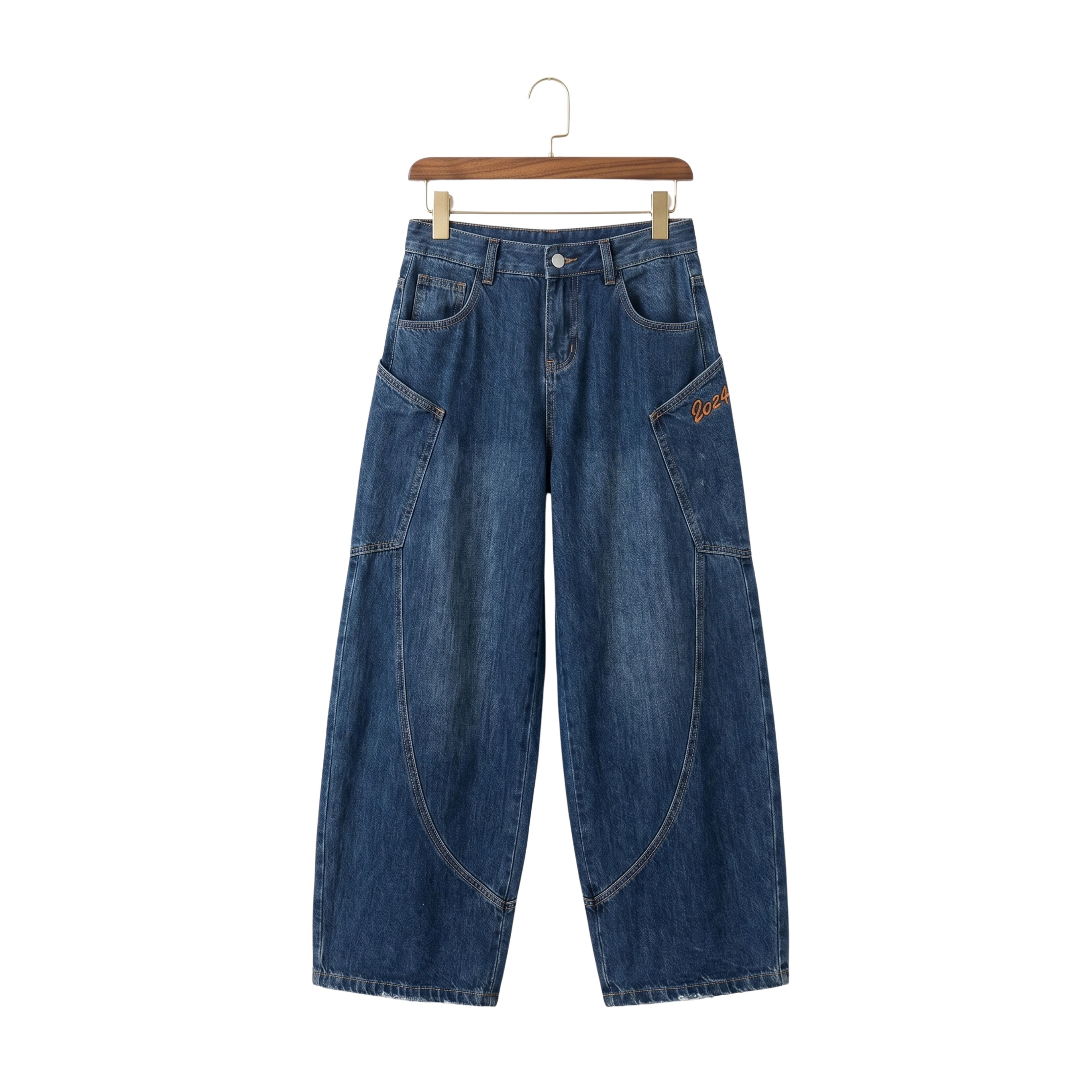 THE CREW unisex Y2K baggy jeans in medium wash denim featuring bold contrast curved seams and an oversized high-street cut