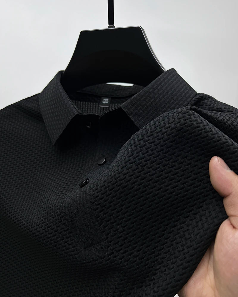 Black solid polo shirt fabric detail – The Crew