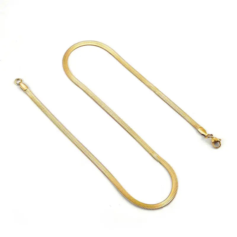 Gold herringbone snake chain flat lay – The Crew