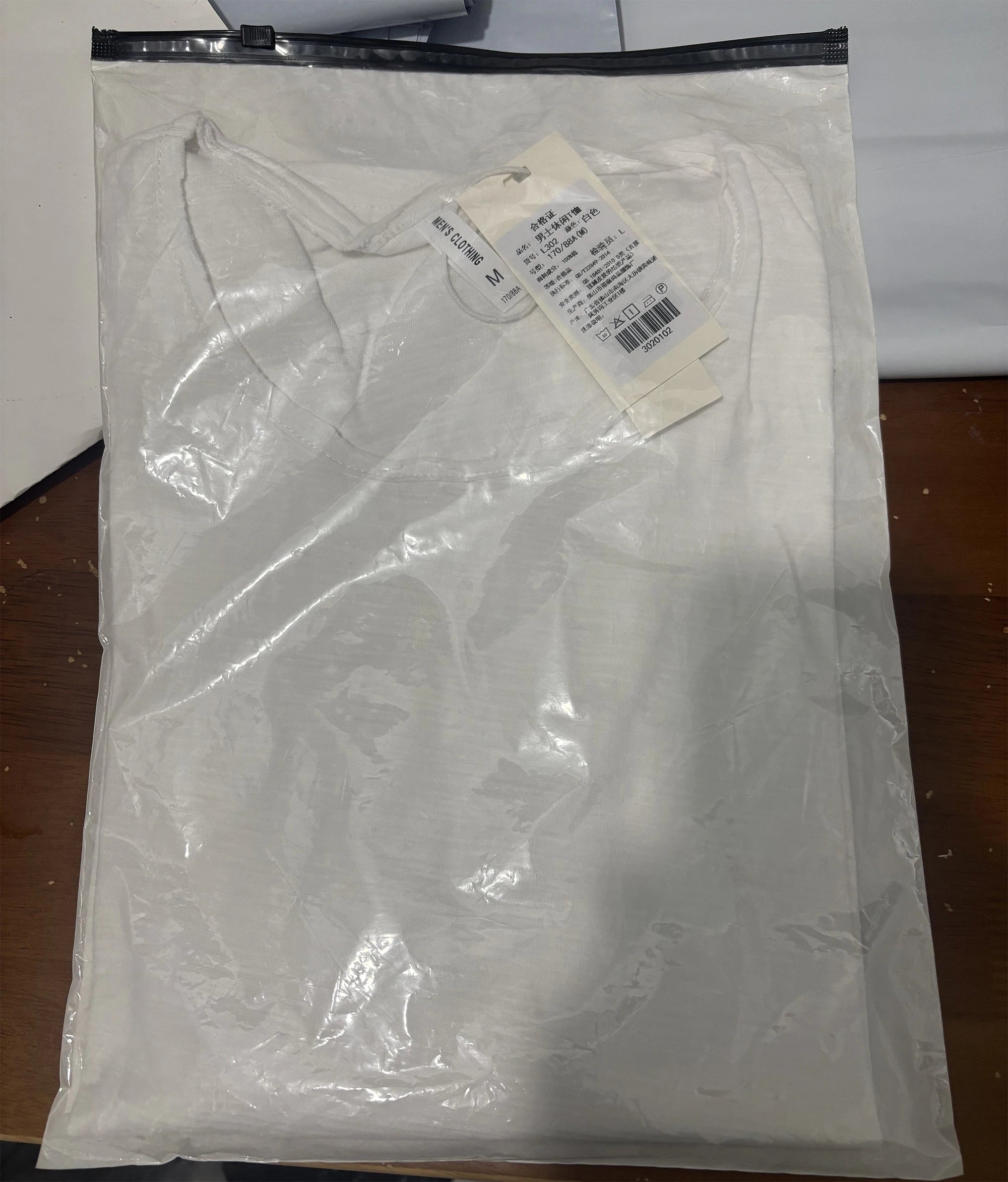 Folded cotton long sleeve T-shirt packaging – The Crew