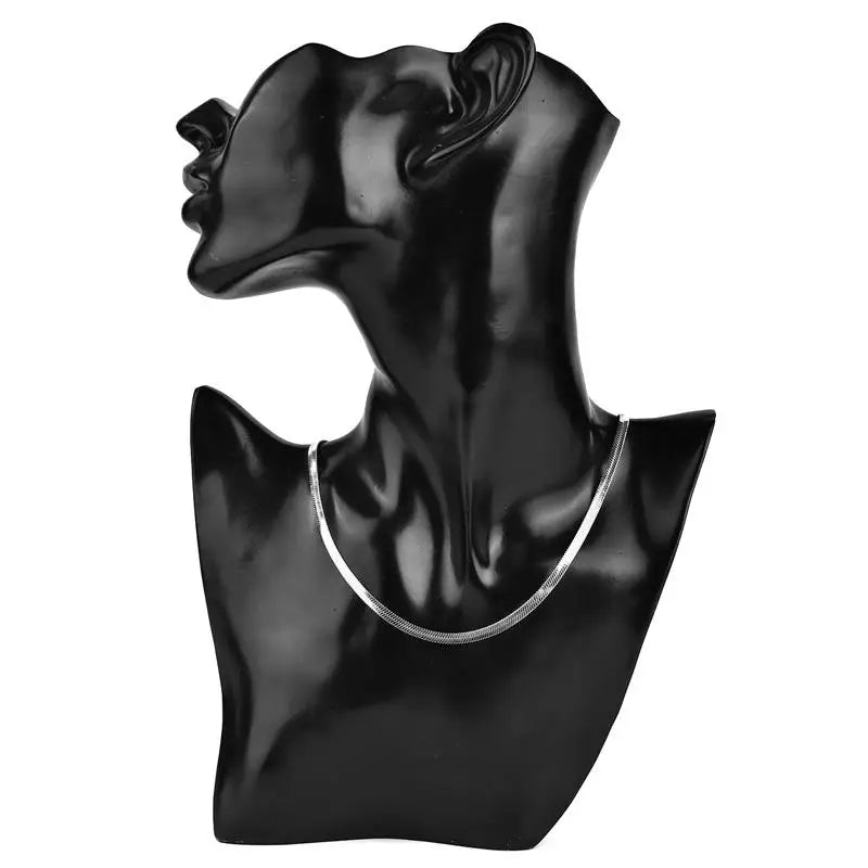 Gold snake chain necklace on black bust – The Crew
