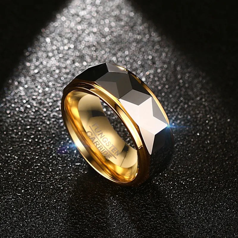 Angled product shot of the Meaeguet geometric faceted tungsten wedding band under lighting, highlighting the mirror-polished gold inner core