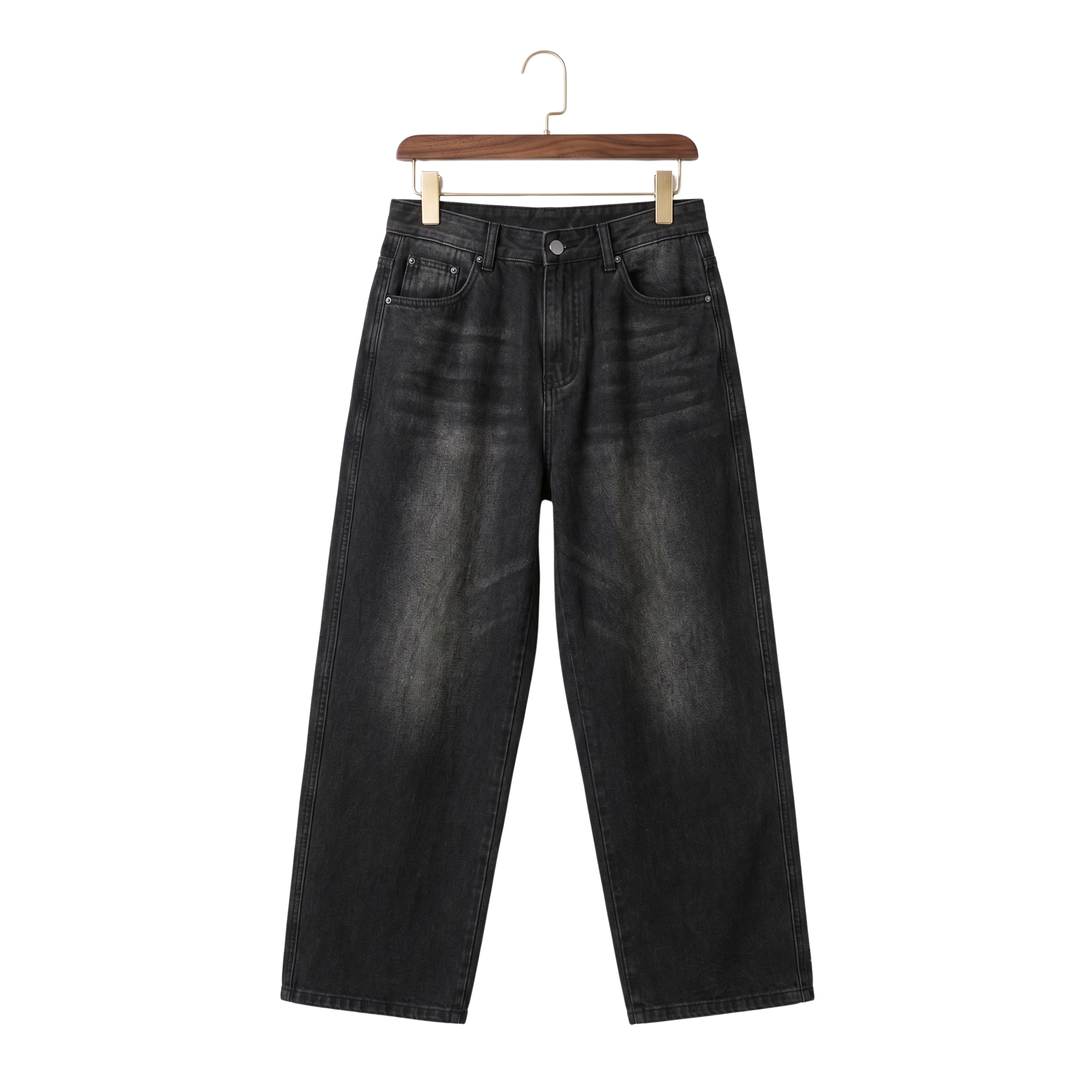 Front studio view of men's pleated micro flared jeans in a washed black denim on a wooden hanger