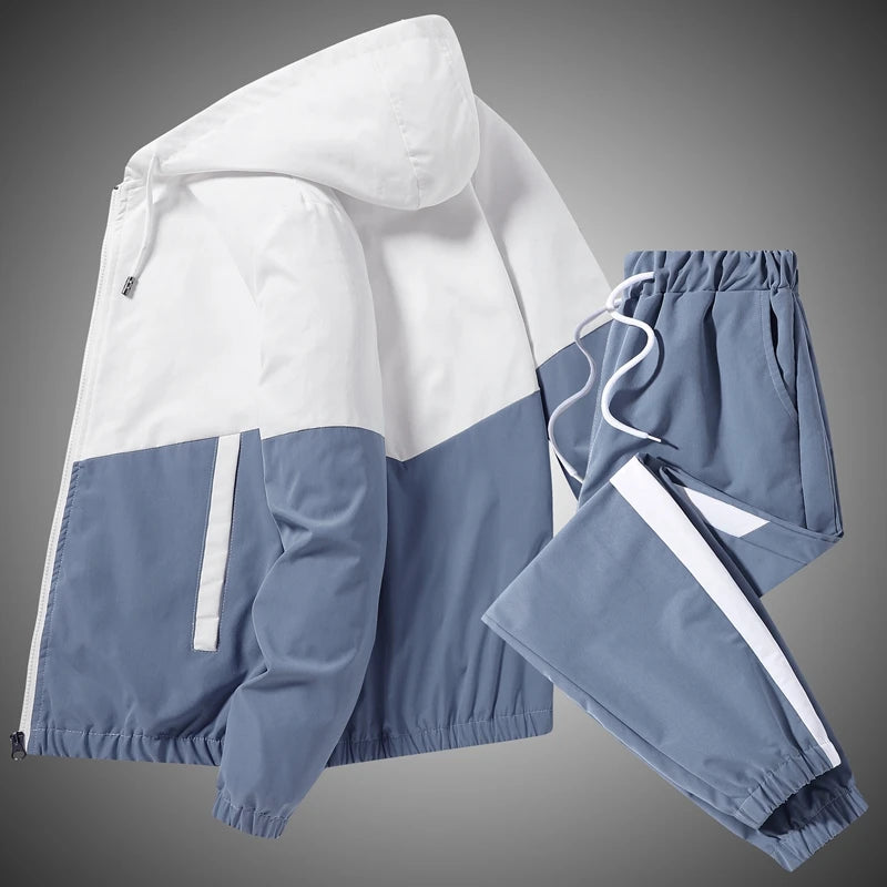 Creative studio flat lay of the light blue and white patchwork hooded sports suit, highlighting the standard thickness premium polyester weave texture