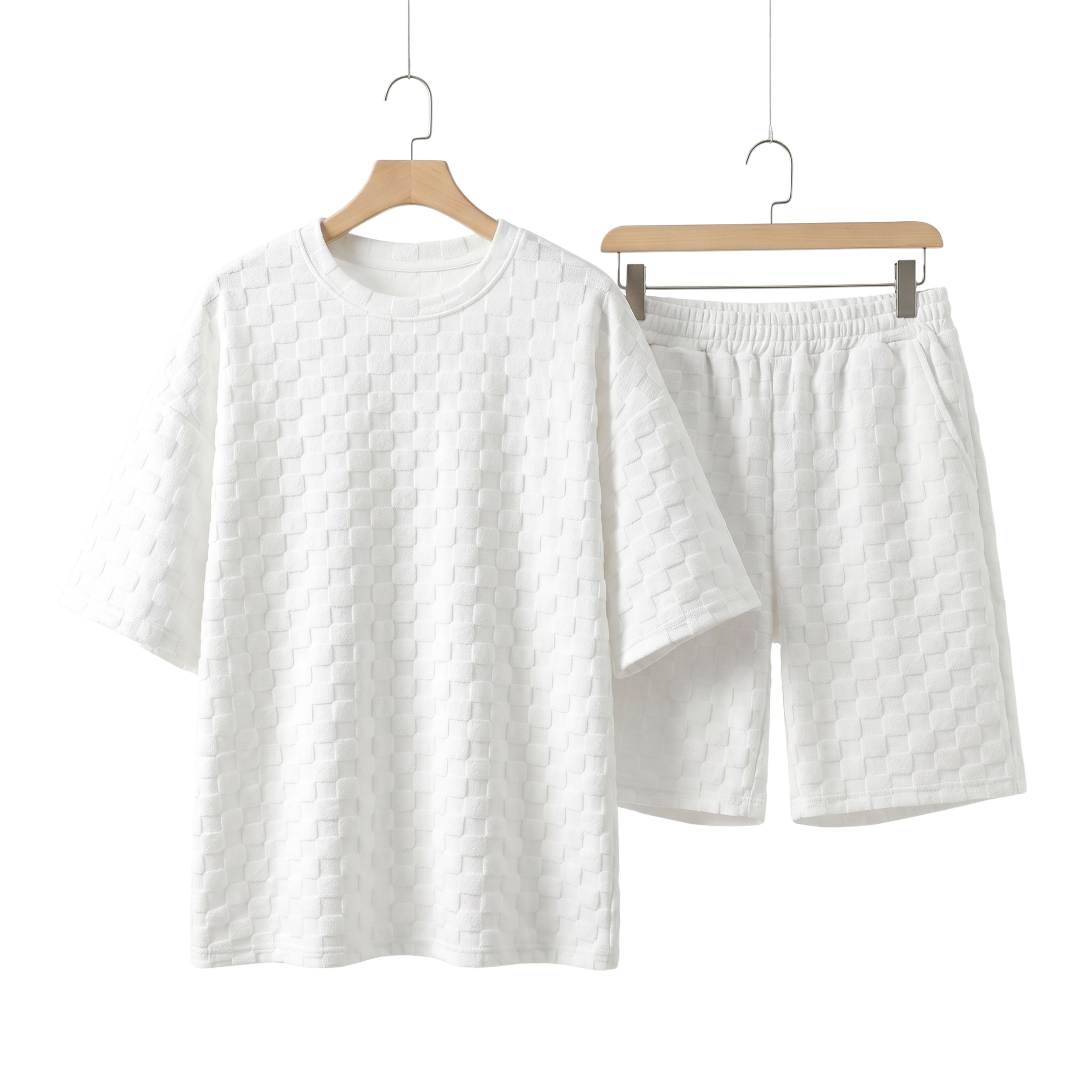 Summer loose-fit coordinated top and shorts set in solid off-white featuring an intricate textured check pattern construction