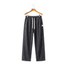 Dark gray loose-fit men's summer jeans made of soft Lyocell fabric featuring an elastic waist and white drawstring on a hanger