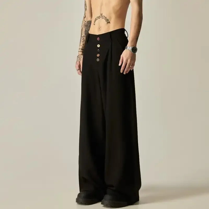 Full body front shot of the premium heavyweight drape and pleated waist construction of the black casual pants