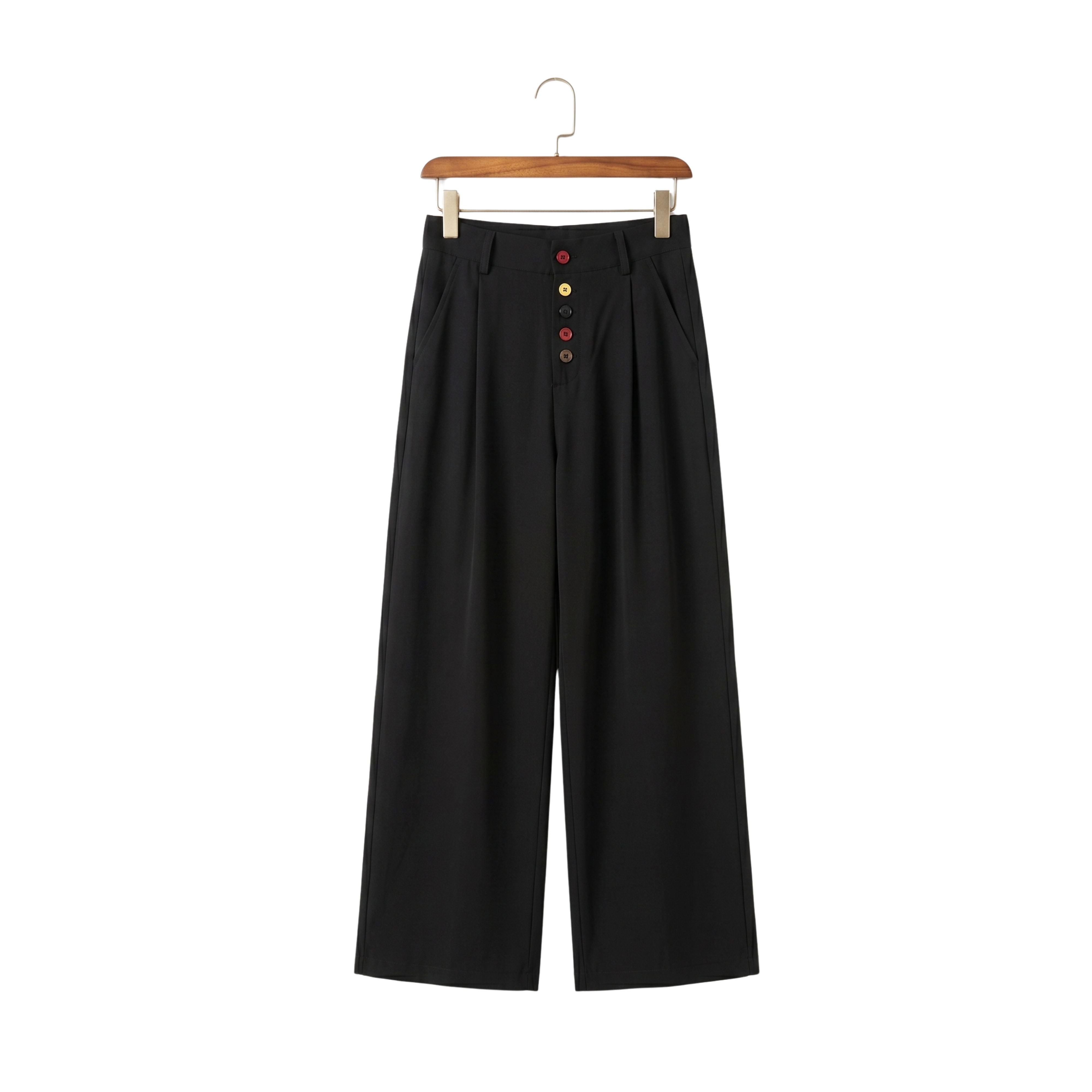 Front view of men's wide-leg pleated trousers in black featuring distinct colorful buttons on a wooden hanger