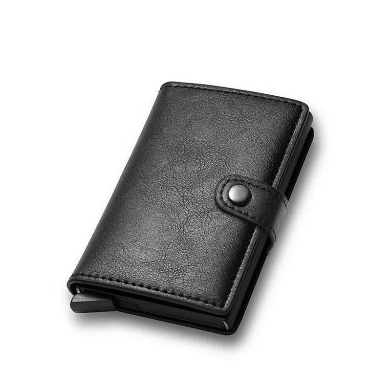 Men's minimalist smart wallet in textured solid black synthetic leather featuring a snap button closure hasp and an integrated aluminum card holder body
