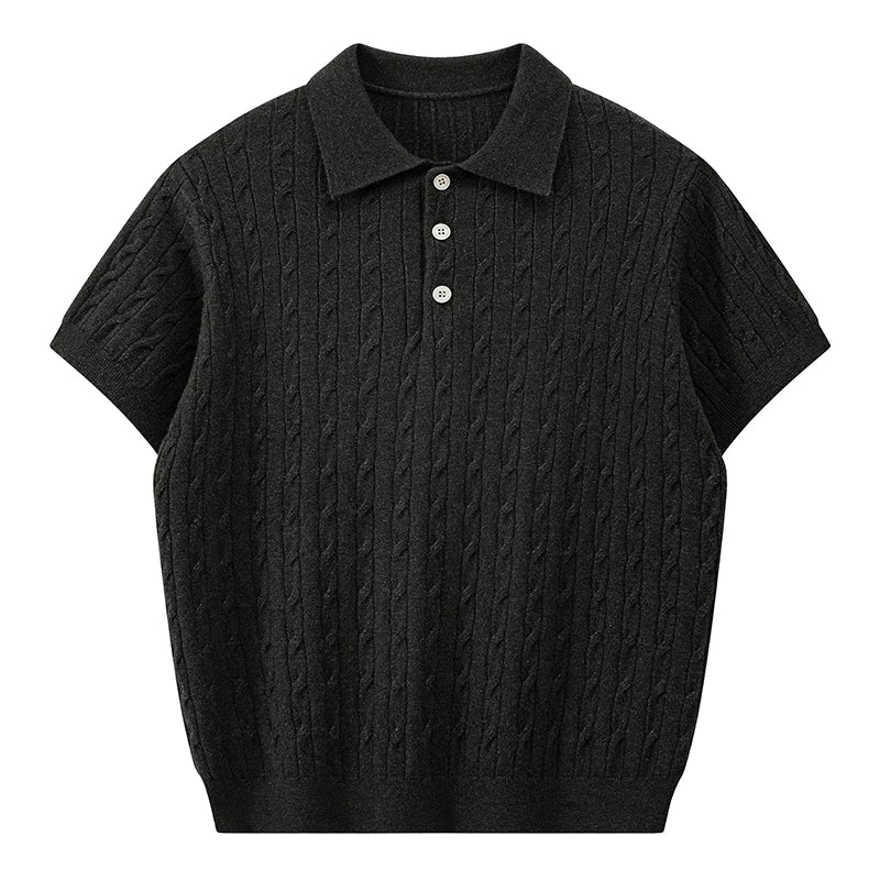 Front view of a classic black men's short-sleeve cable knit polo shirt with black buttons against a white background