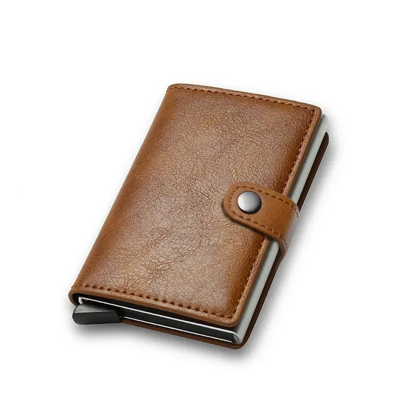 Compact RFID blocking mini wallet wrapped in a classic light tan brown leather cover with an automatic bottom slider lever