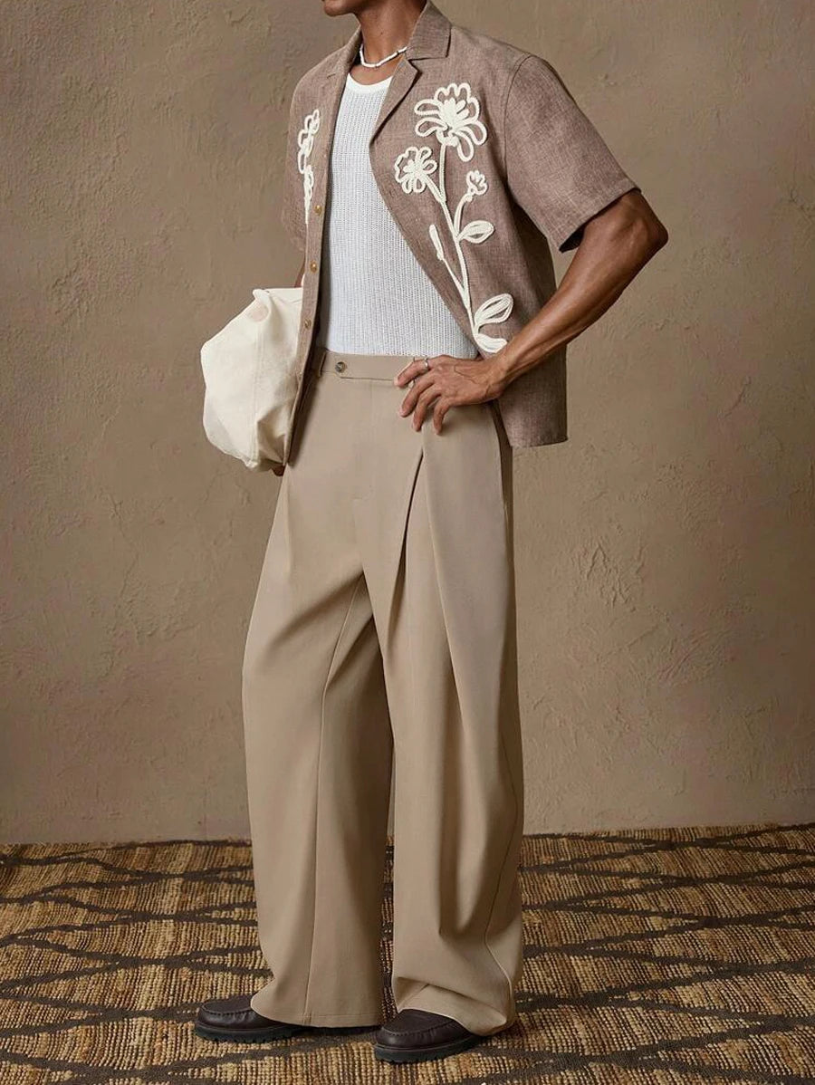 Side view of a man styling khaki high-waisted business pants with a smart casual short-sleeve shirt